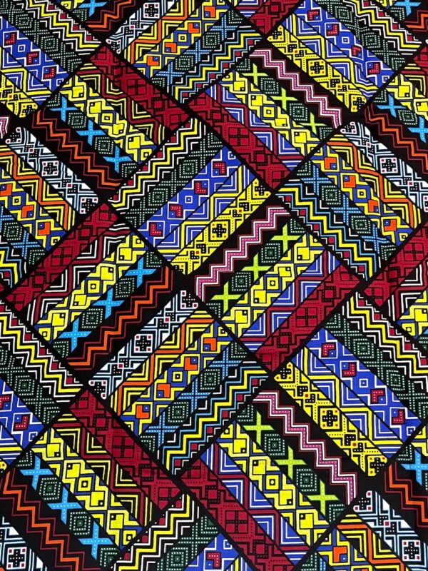 Colorful geometric patterned fabric with a mix of red, yellow, blue, and black.