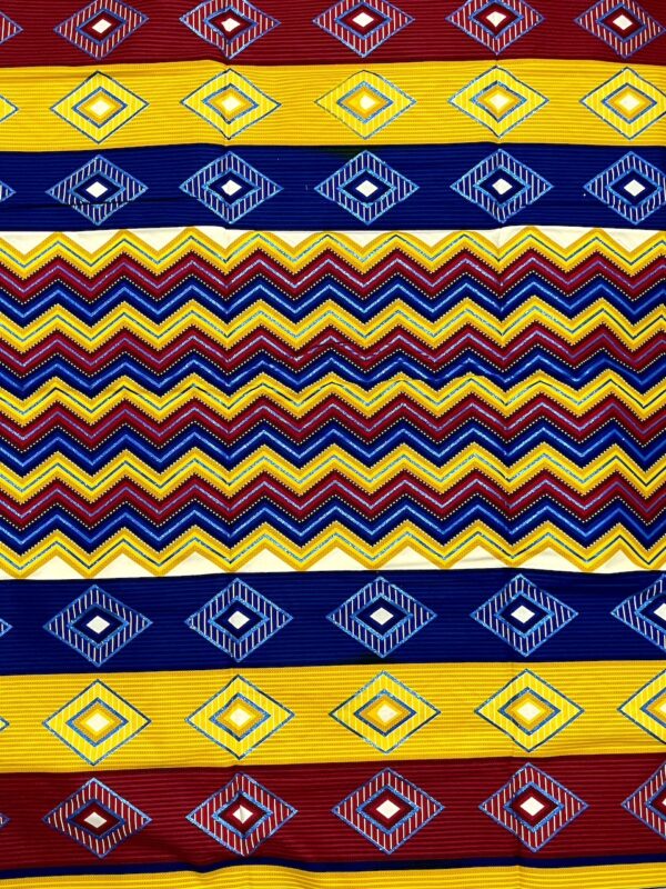 Colorful fabric pattern with geometric designs in red, yellow, and blue.