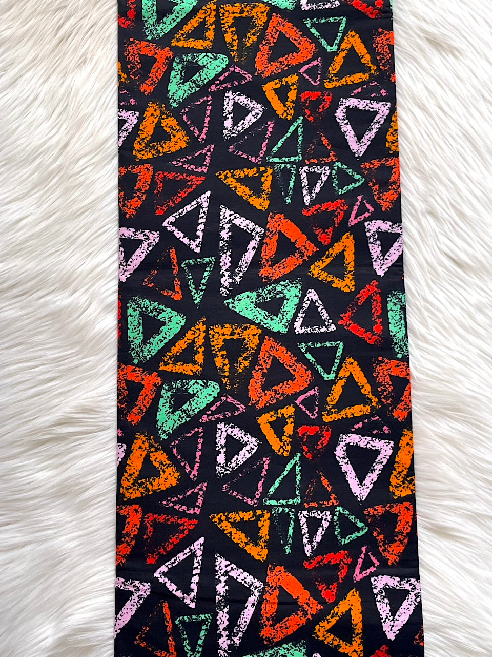 Colorful triangle pattern on a black background