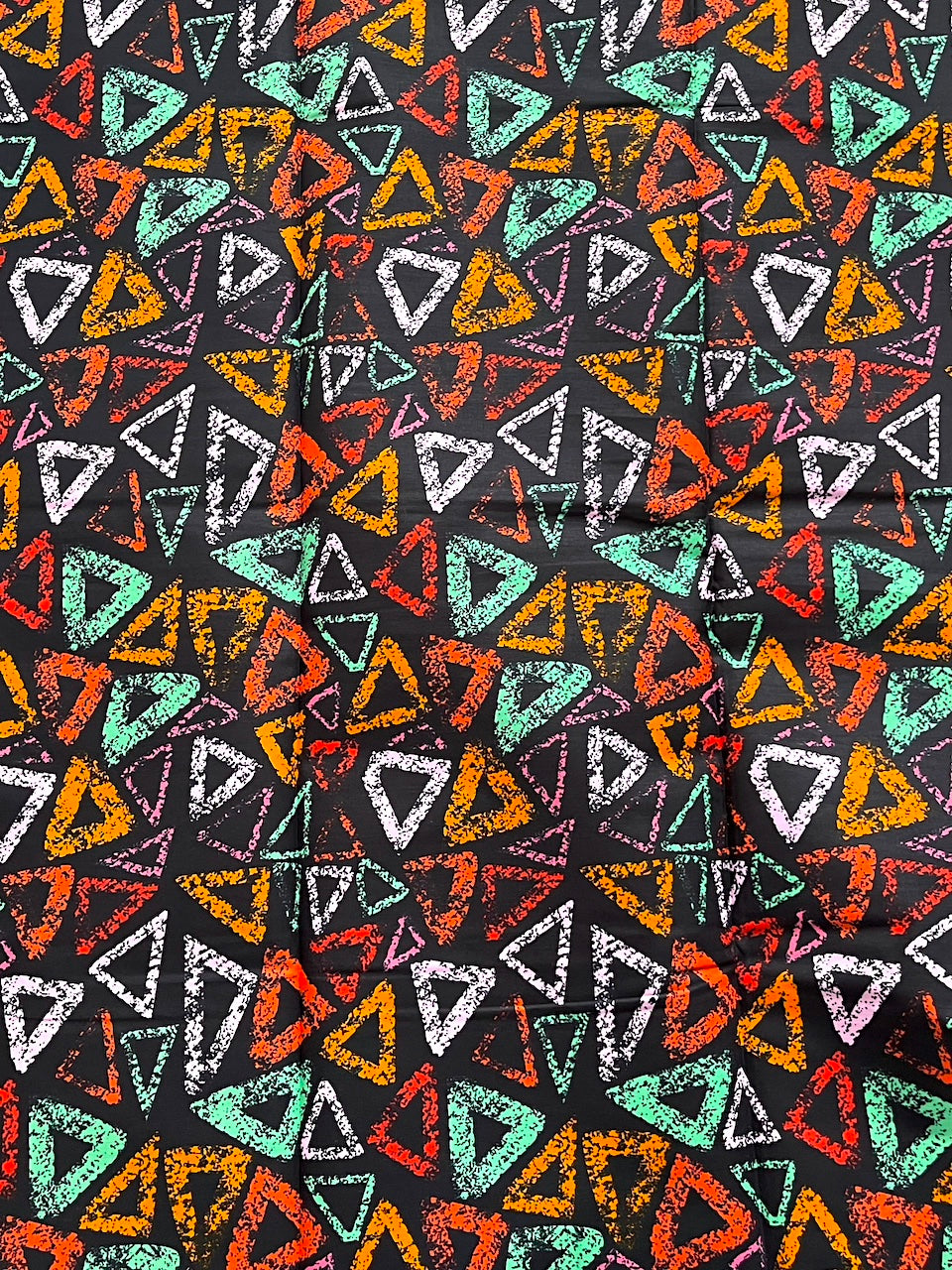 Pattern of colorful triangles on a black background
