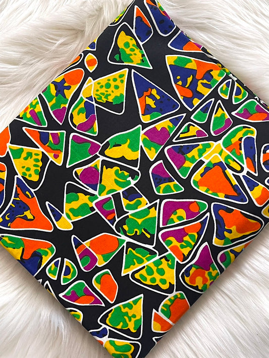 Colorful geometric patterned fabric on a white surface