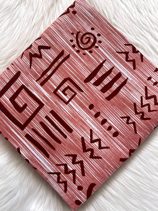 Card with tribal pattern on a textured white surface