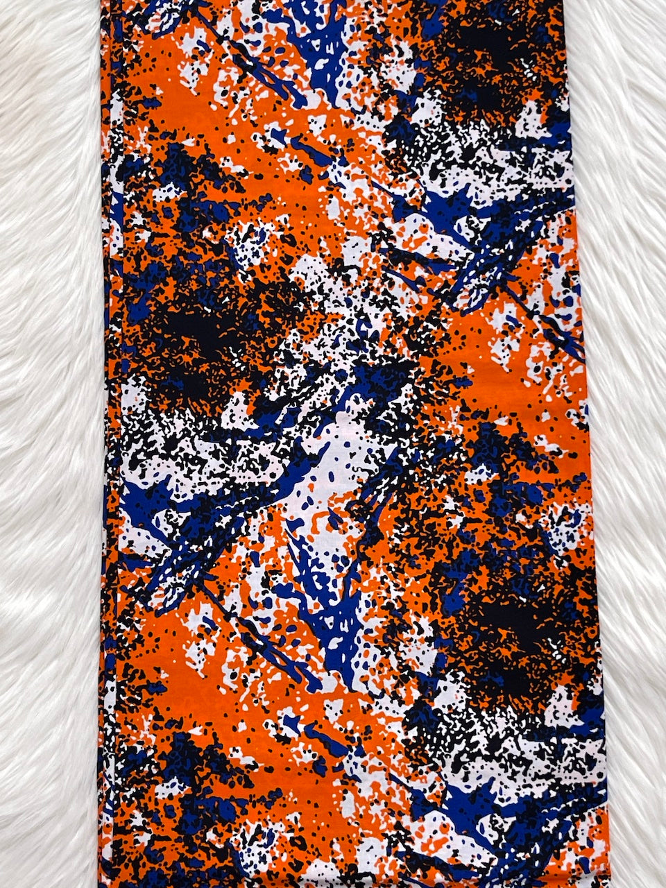 Colorful abstract patterned fabric on a white background