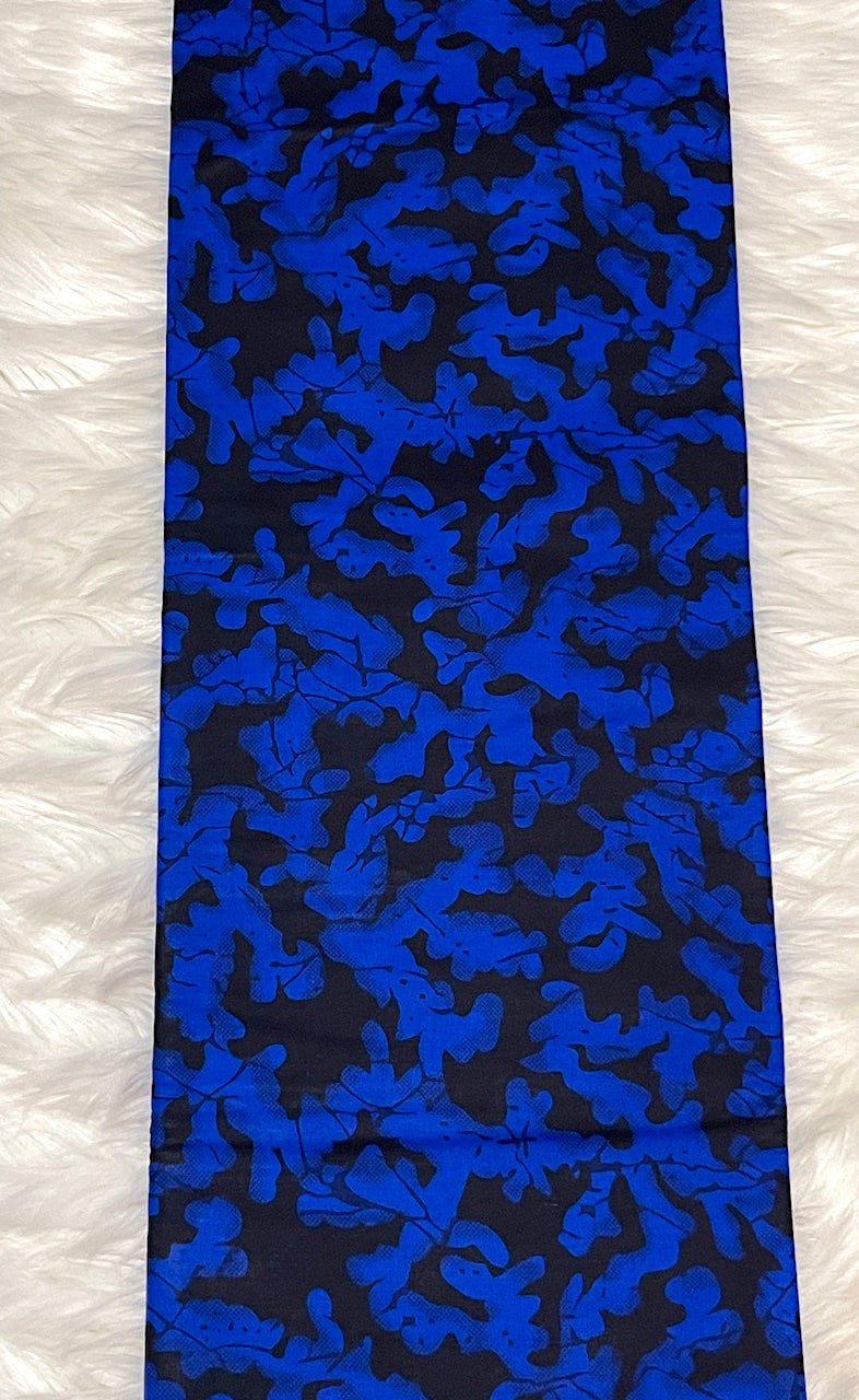 Blue and black patterned fabric on a white background