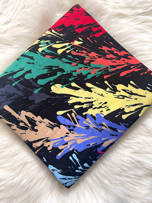 Colorful abstract splatter pattern on a black background