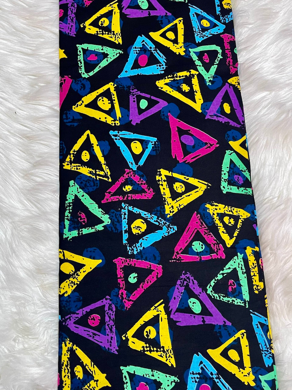 Colorful triangle pattern on a black background