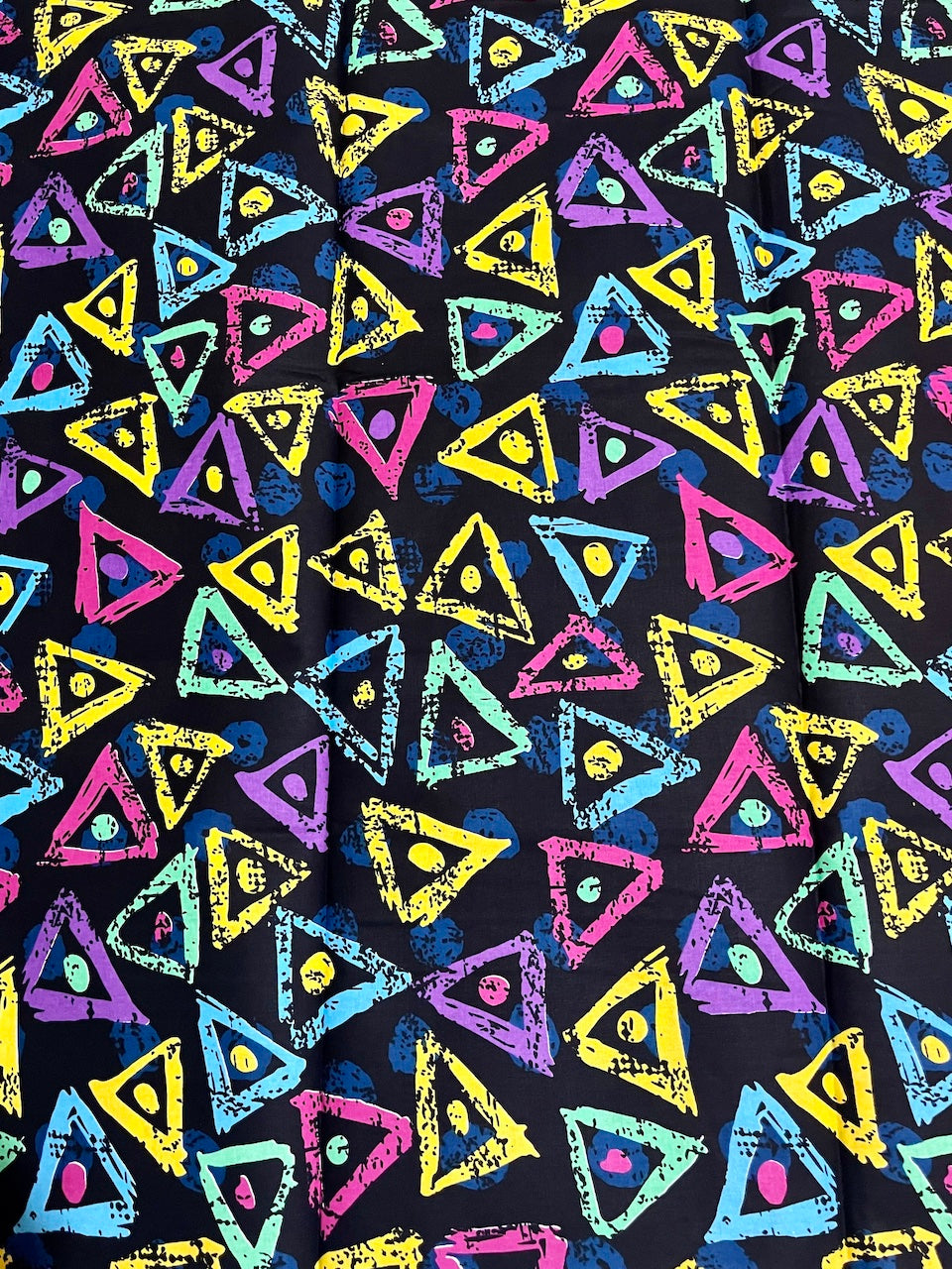 Colorful triangle pattern on a black background