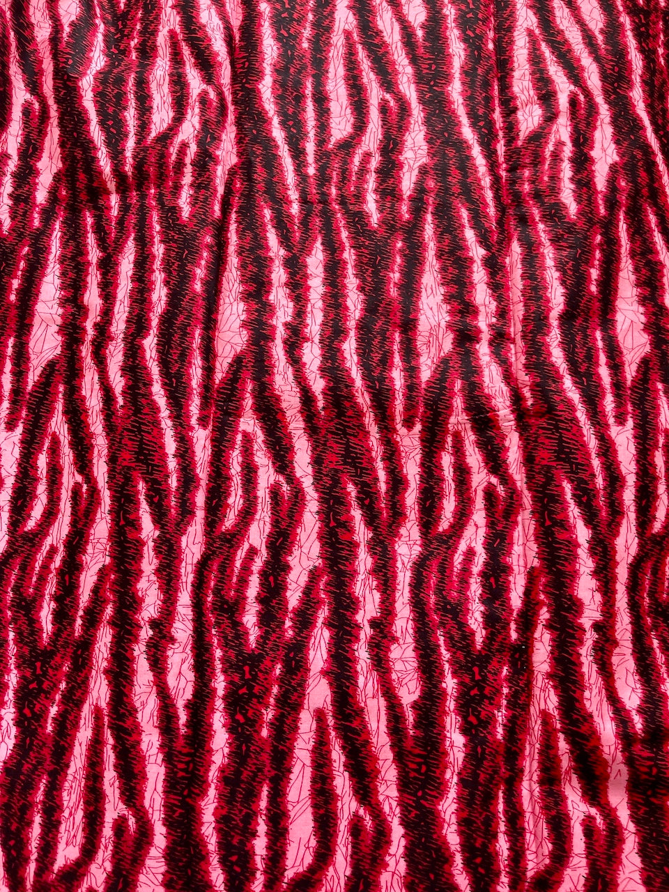Textured red and black patterned fabric
