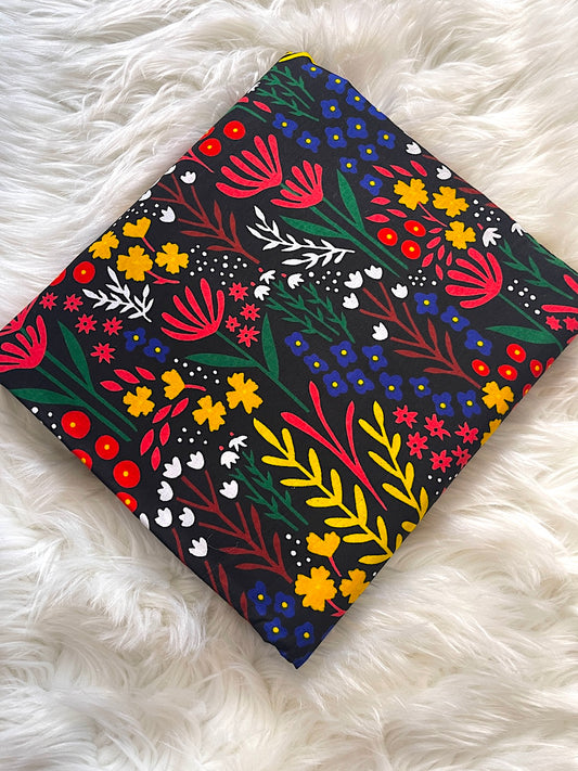 Floral-patterned fabric on a white fluffy surface