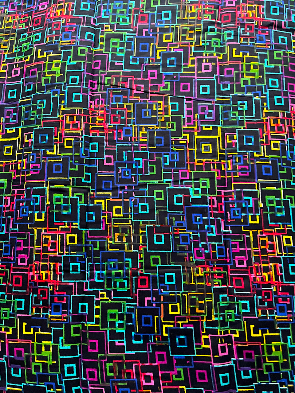 Colorful geometric square pattern on a black background