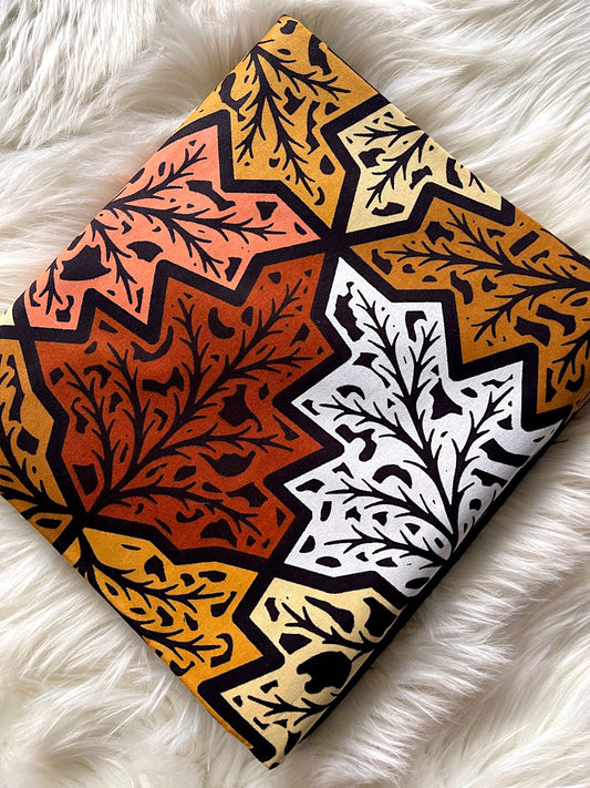 Patterned fabric with geometric design on a white fur background