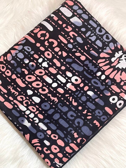 Patterned notebook with pink, purple, and white design on a light background
