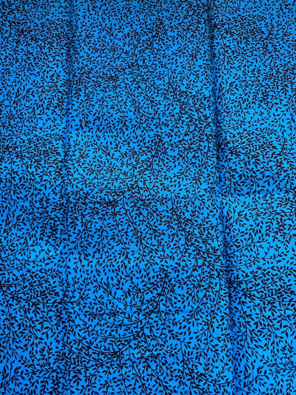 Blue fabric with black floral pattern
