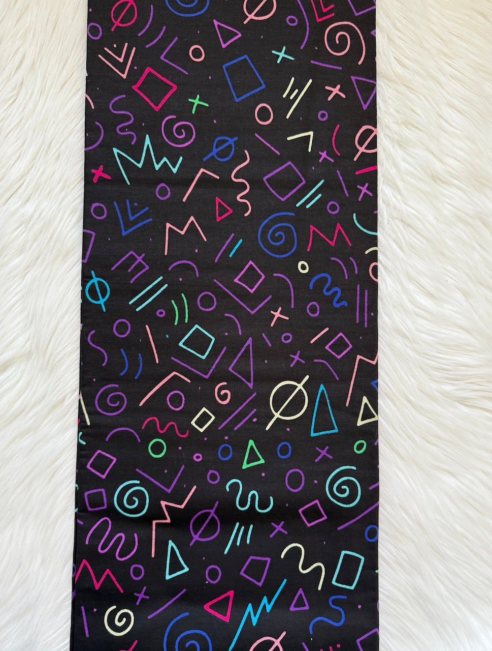 Colorful geometric pattern on a black background
