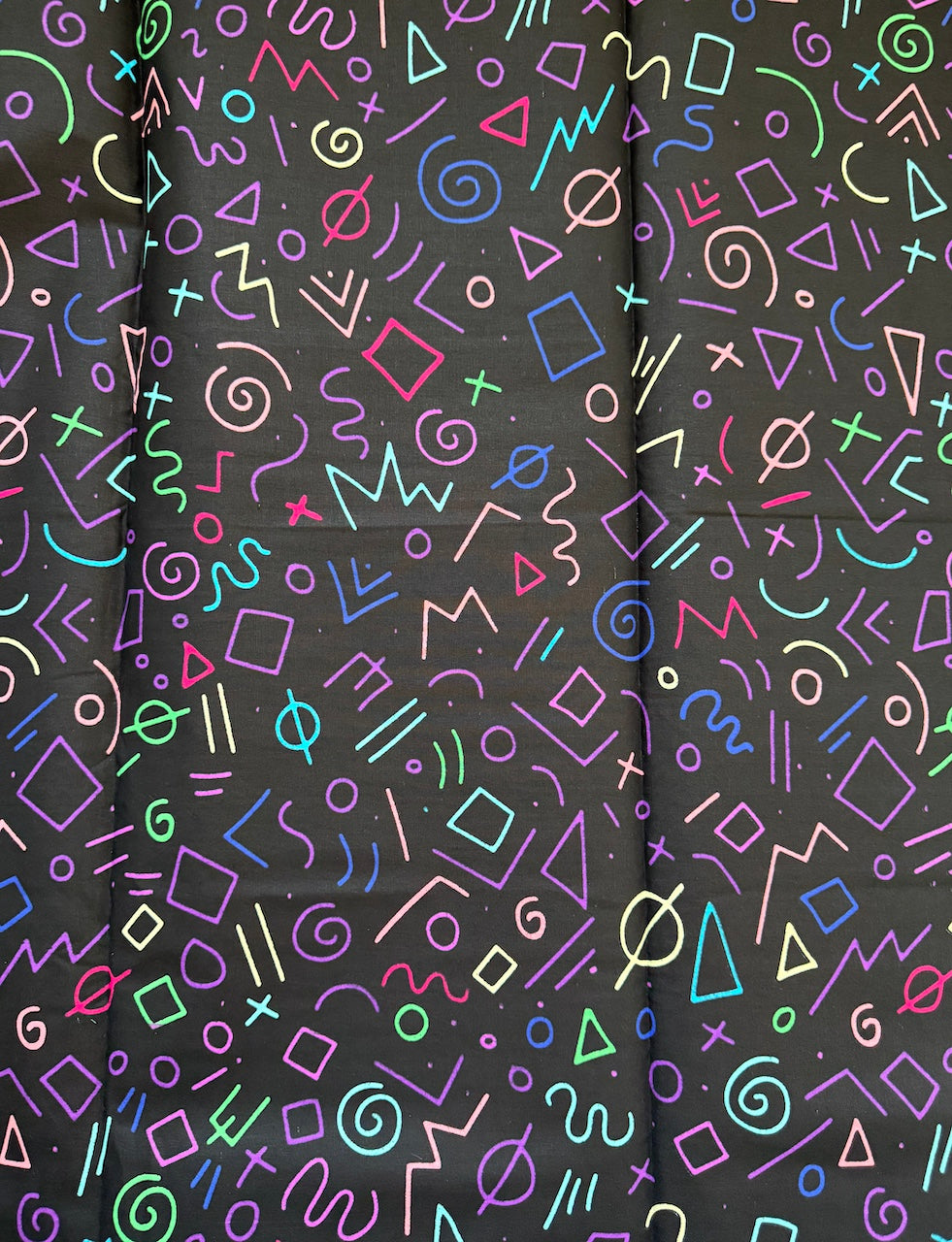 Colorful geometric pattern on a black background