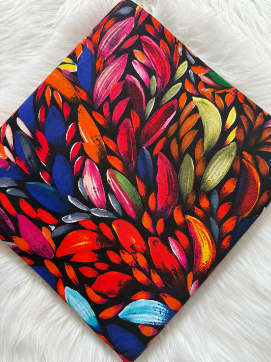 Colorful abstract leaf pattern on a black background