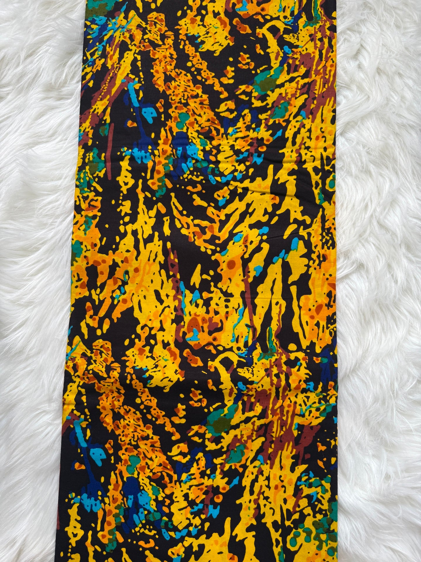 Colorful tie with abstract pattern on a white textured background