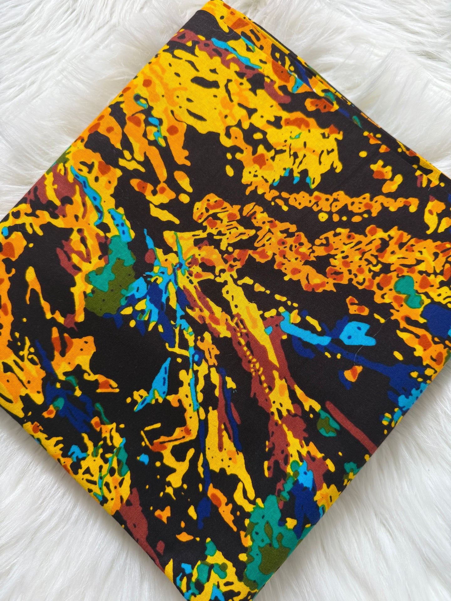 Colorful abstract patterned fabric on a white background