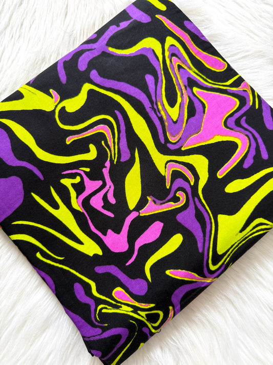 Colorful abstract patterned fabric on a white background