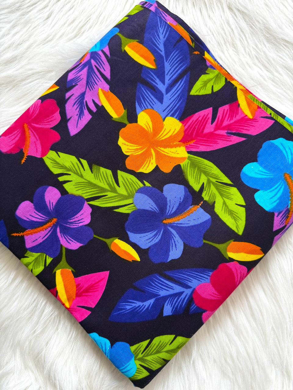 Colorful floral patterned fabric on a white background