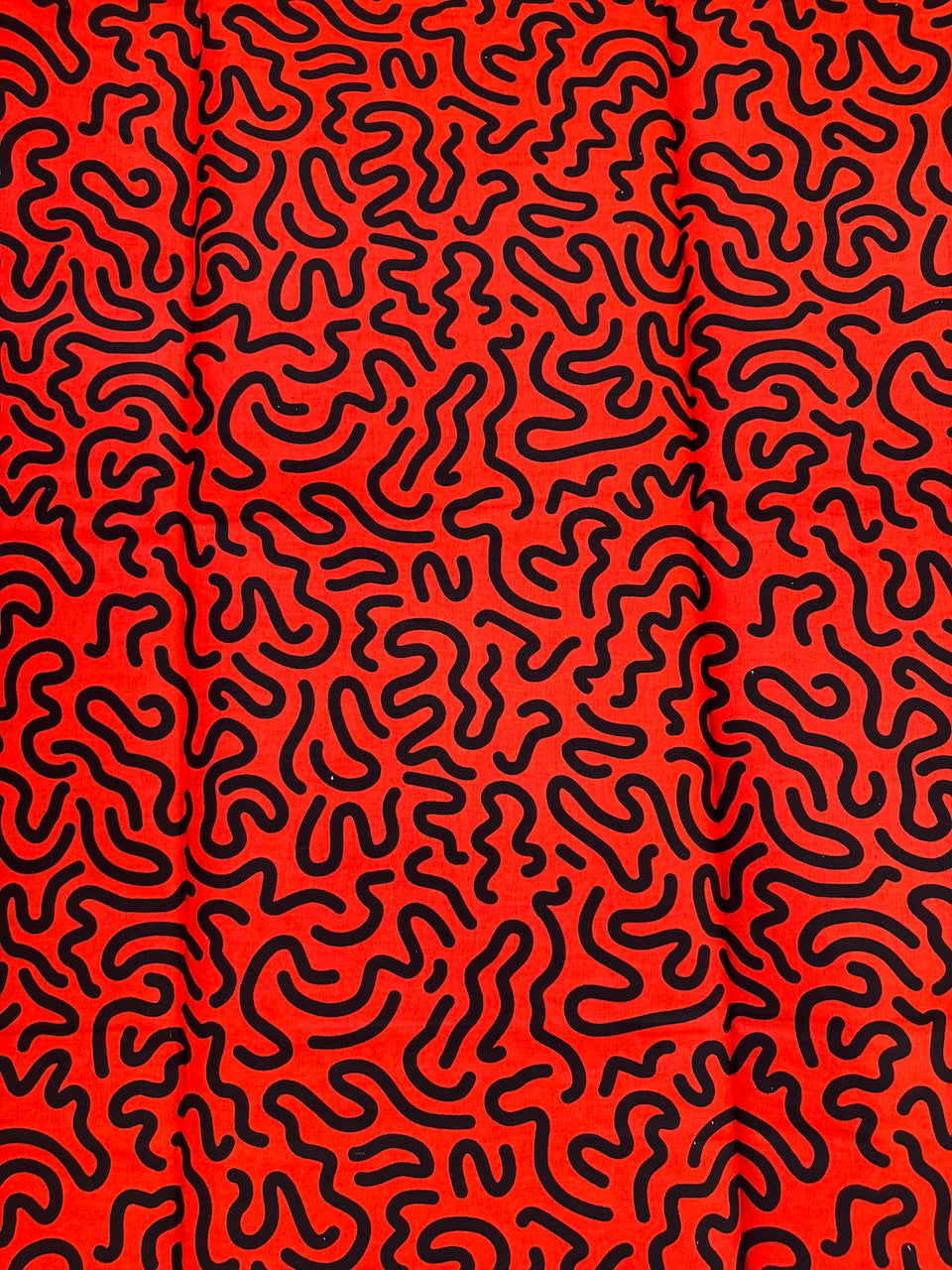 Red background with black wavy line pattern