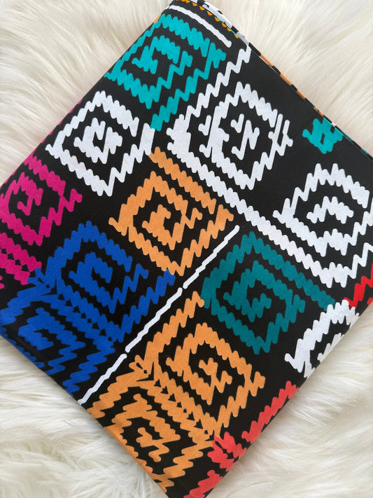 Colorful patterned fabric on a white surface