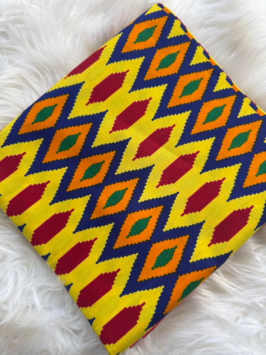 Colorful geometric patterned fabric on a white fluffy surface