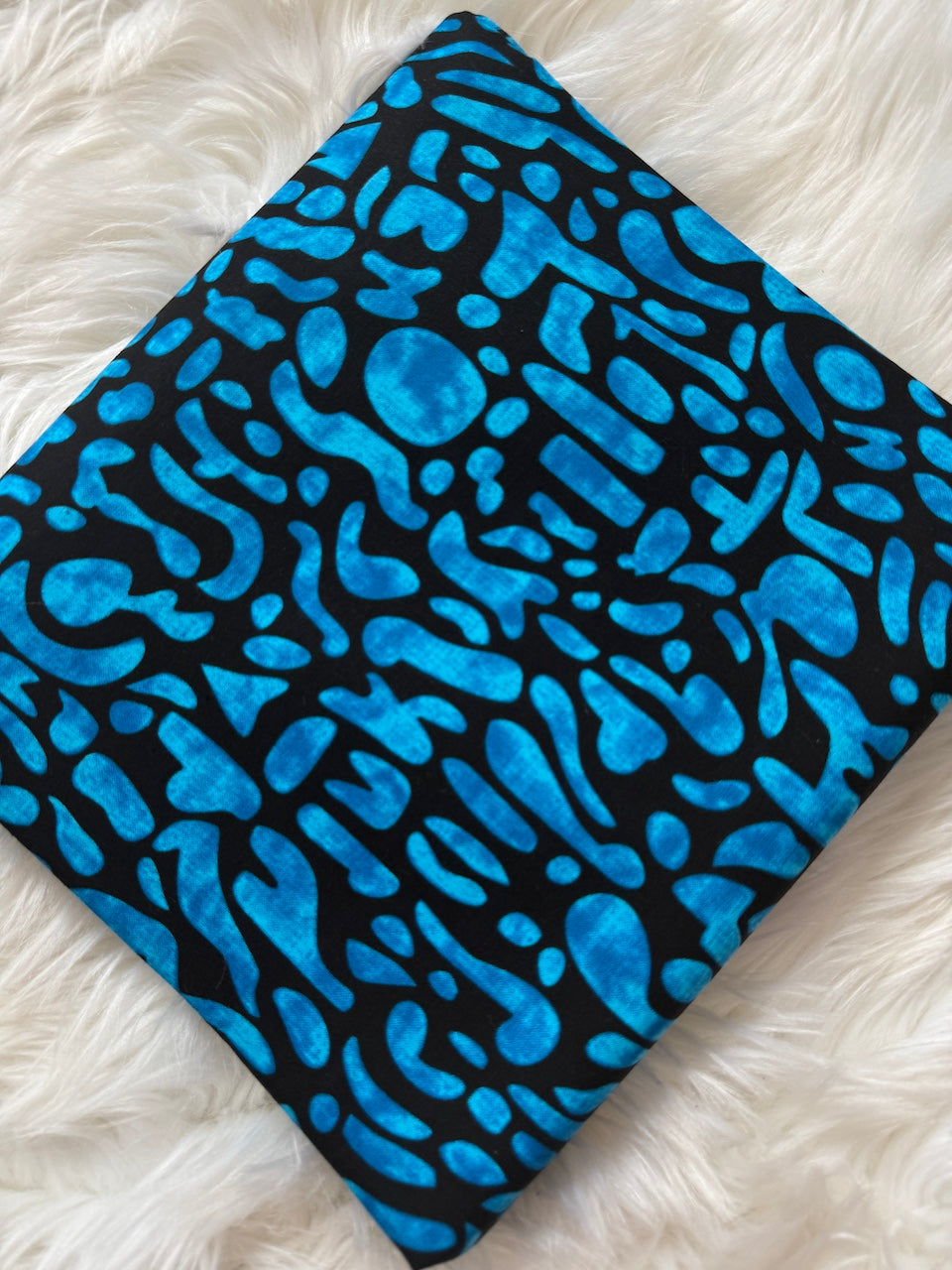 Blue abstract pattern on a black background