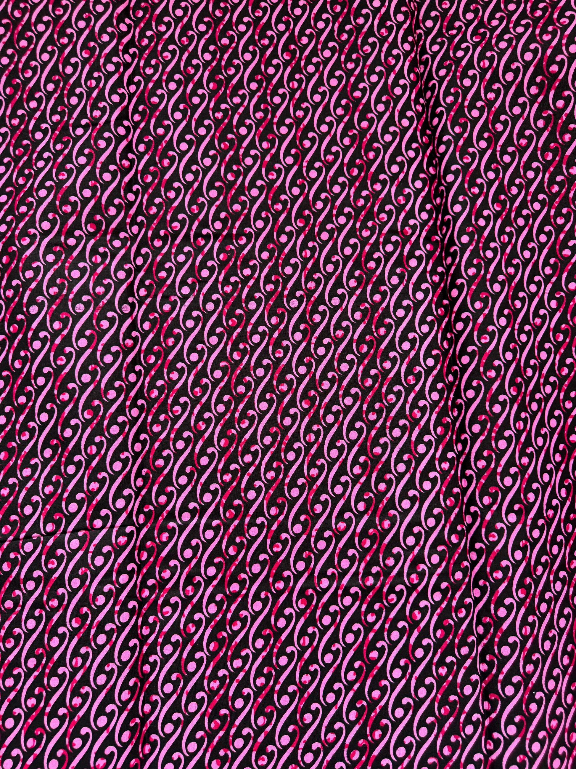 Close-up of a textured pink fabric with a chain-like pattern