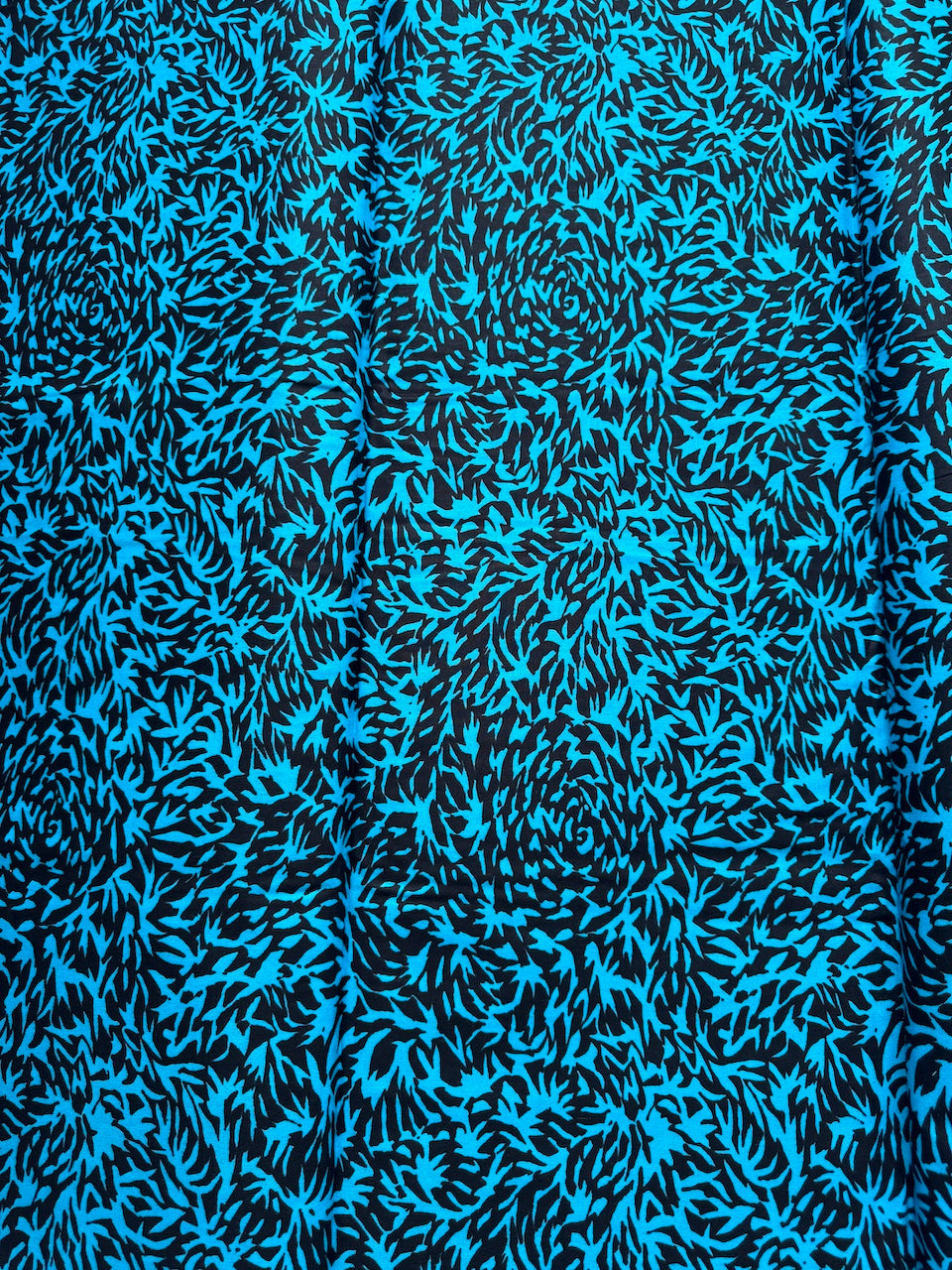 Blue and black abstract patterned fabric