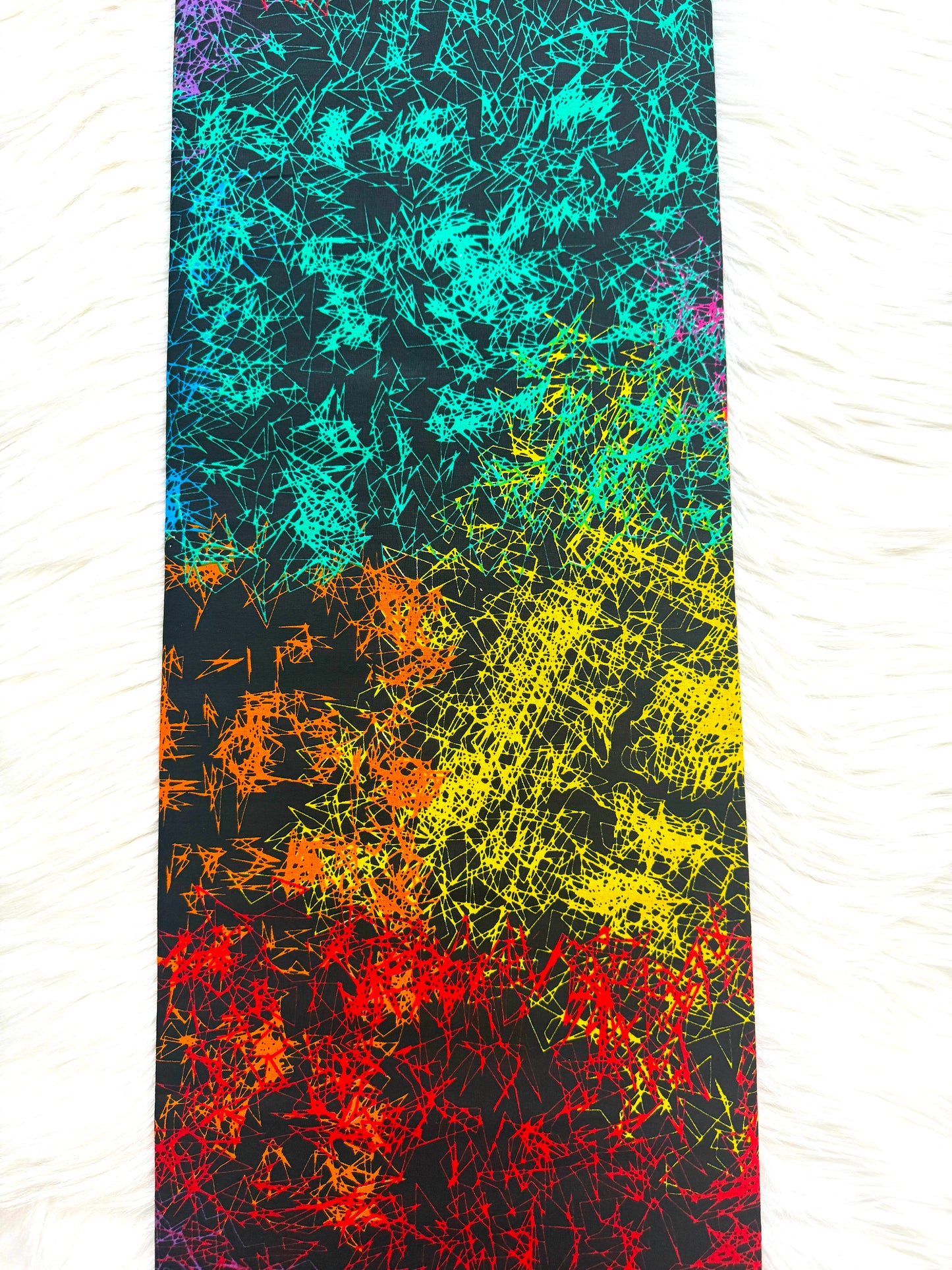 Colorful abstract pattern on a textured fabric background