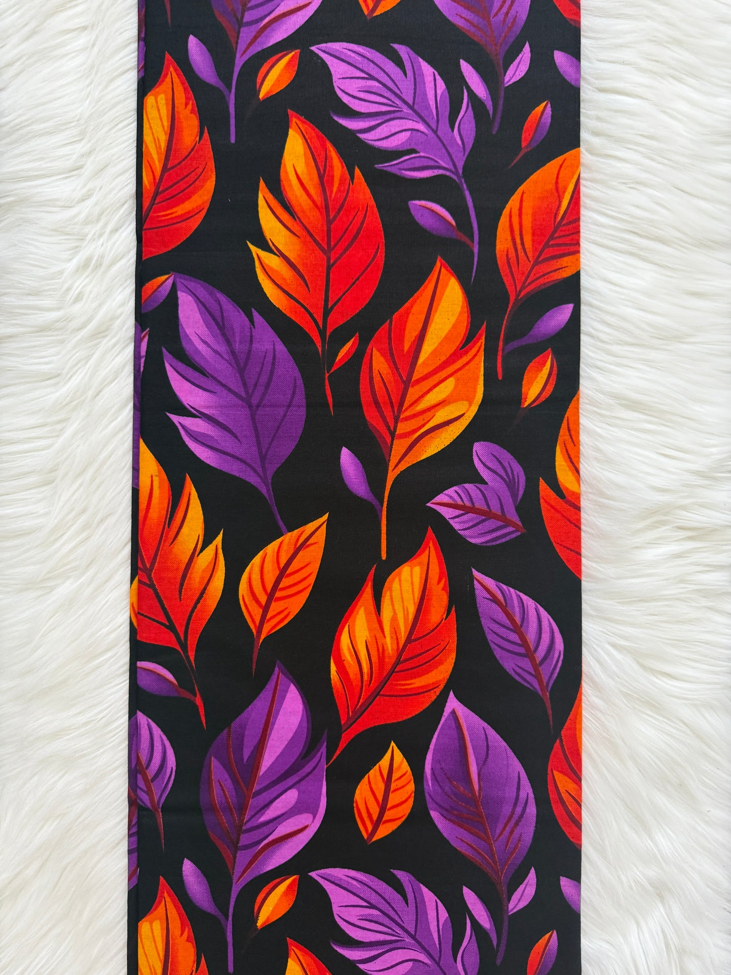 Colorful leaf pattern on a black background