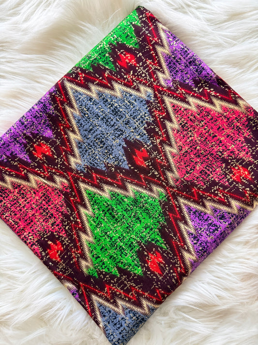 Colorful patterned fabric on a white fluffy surface