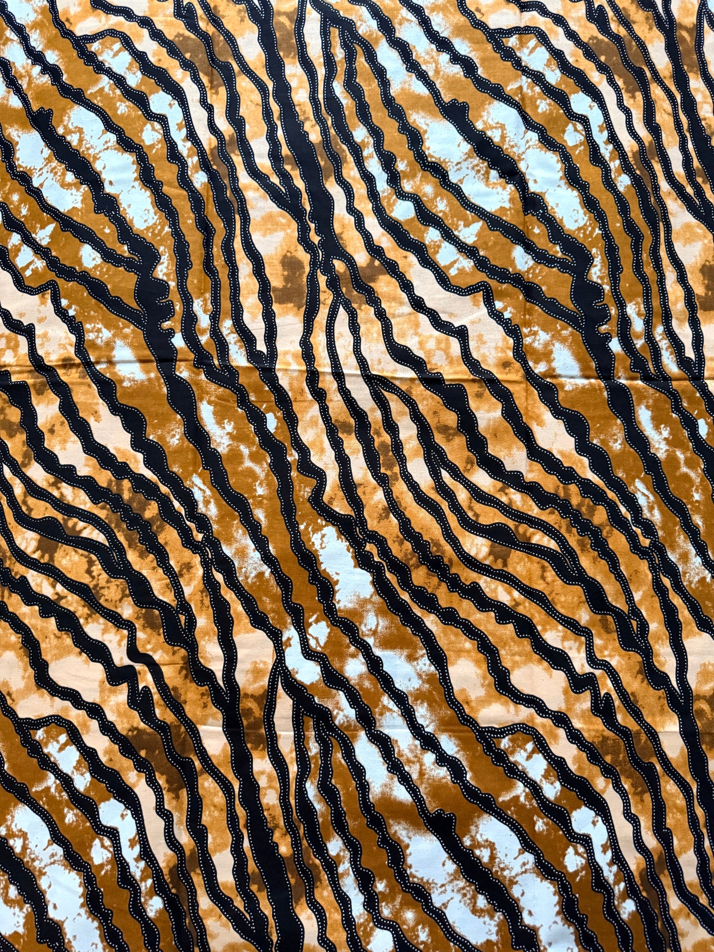 Fabric with zebra pattern in brown, black, and white