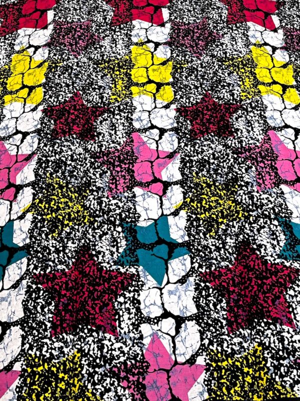 Colorful patterned fabric with stars and abstract shapes