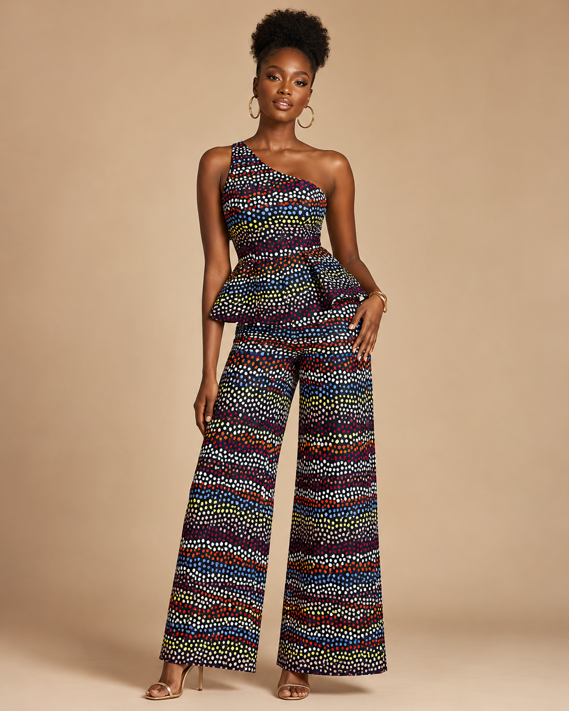 Woman wearing a colorful patterned jumpsuit on a beige background